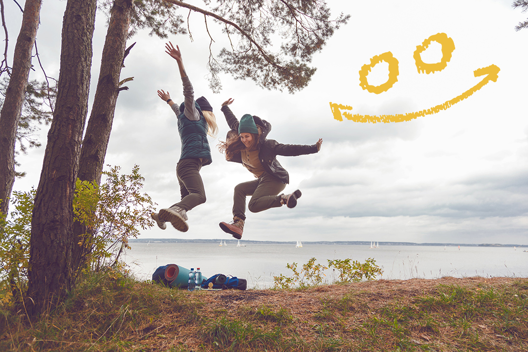 Happy travelers women jumping. Team success concept